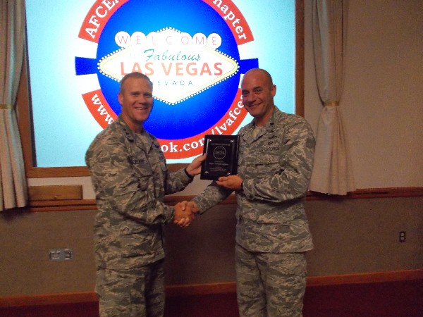 Lt. Col. Kyle Kloeckner, USAF (r), chapter president, presents Maj. Gen. Jeffrey Lofgren, USAF, commander, U.S. Air Force Warfare Center, with an appreciation plaque at the chapter's June luncheon. With a crowd of more than 70 in attendance, the general discussed how the Air Force Warfare Center is leading efforts to integrate air, space and cyberspace domains for tomorrow's warfighters.